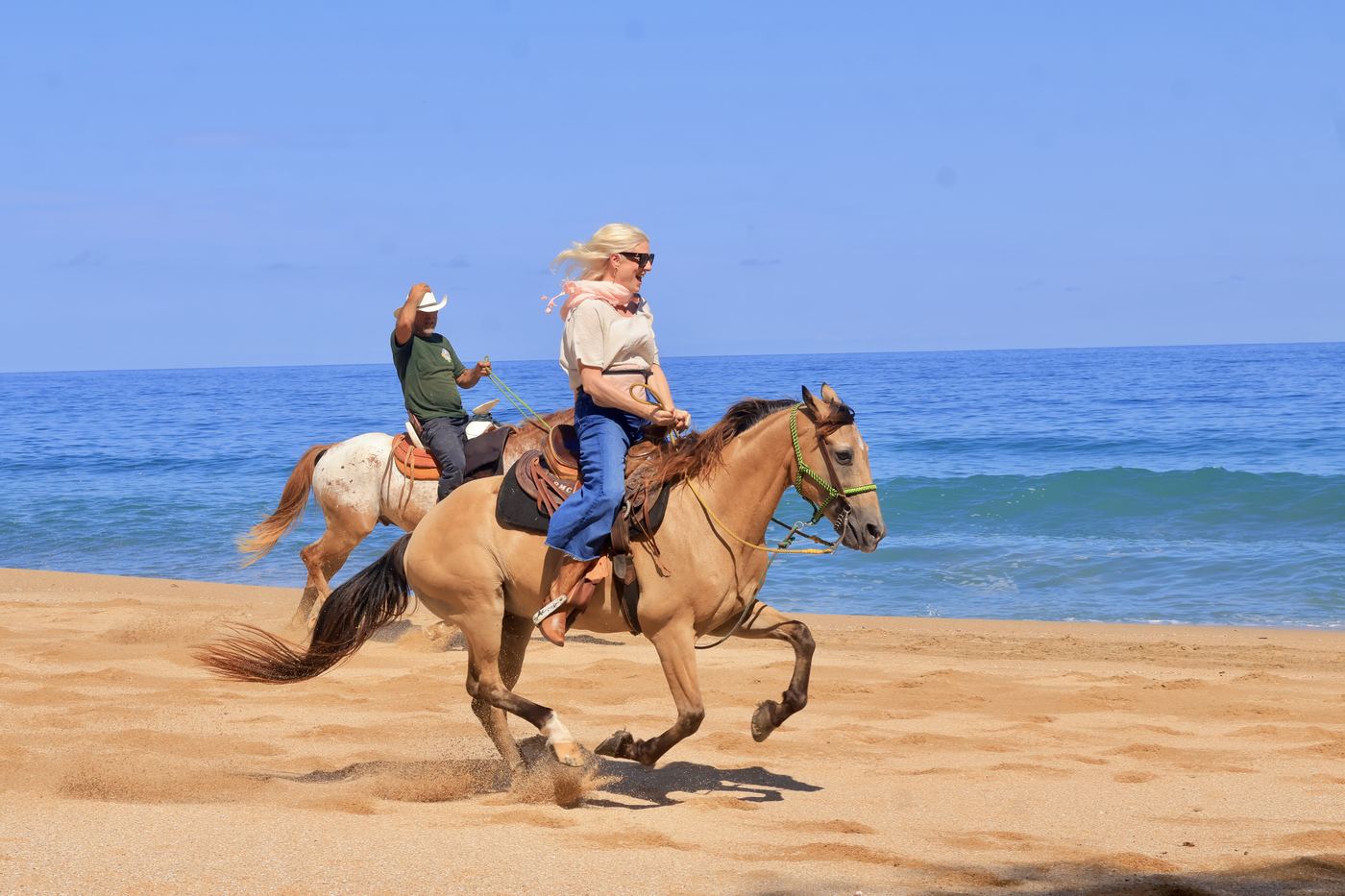 Riding at a gallop along the shore