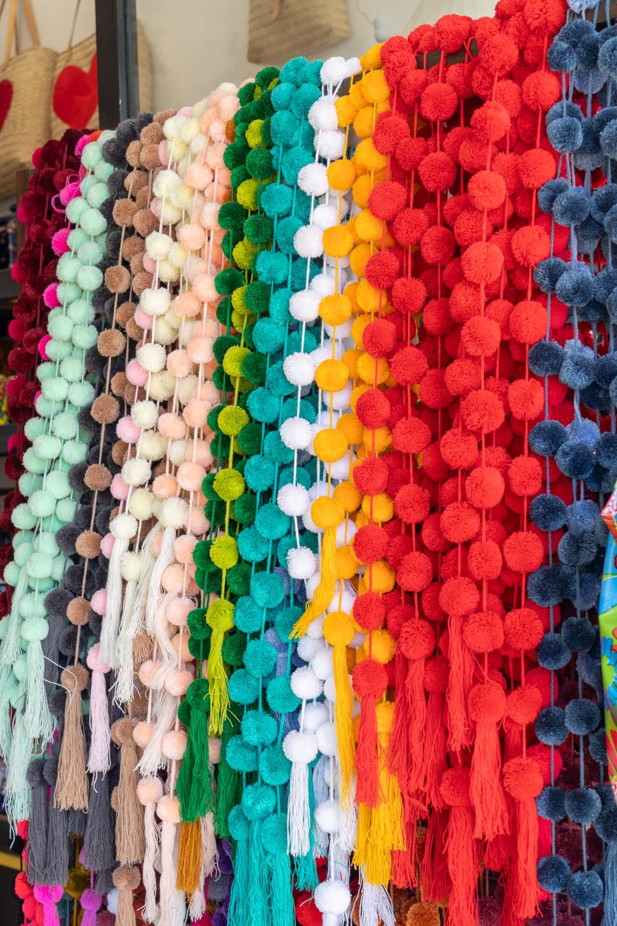 Colored pom-poms in a market stall